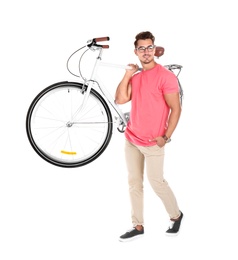 Handsome young hipster man with bicycle on white background