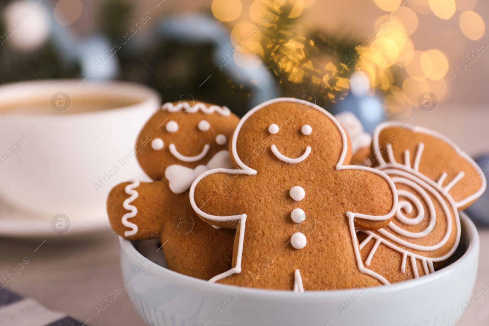 Photo of Delicious Christmas cookies in bowl, closeup view