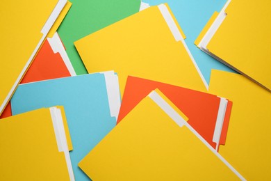 Many different files with documents as background, top view