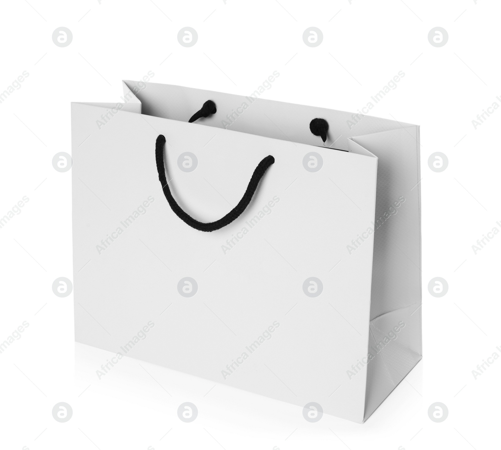 Photo of Paper shopping bag isolated on white. Mock up for design