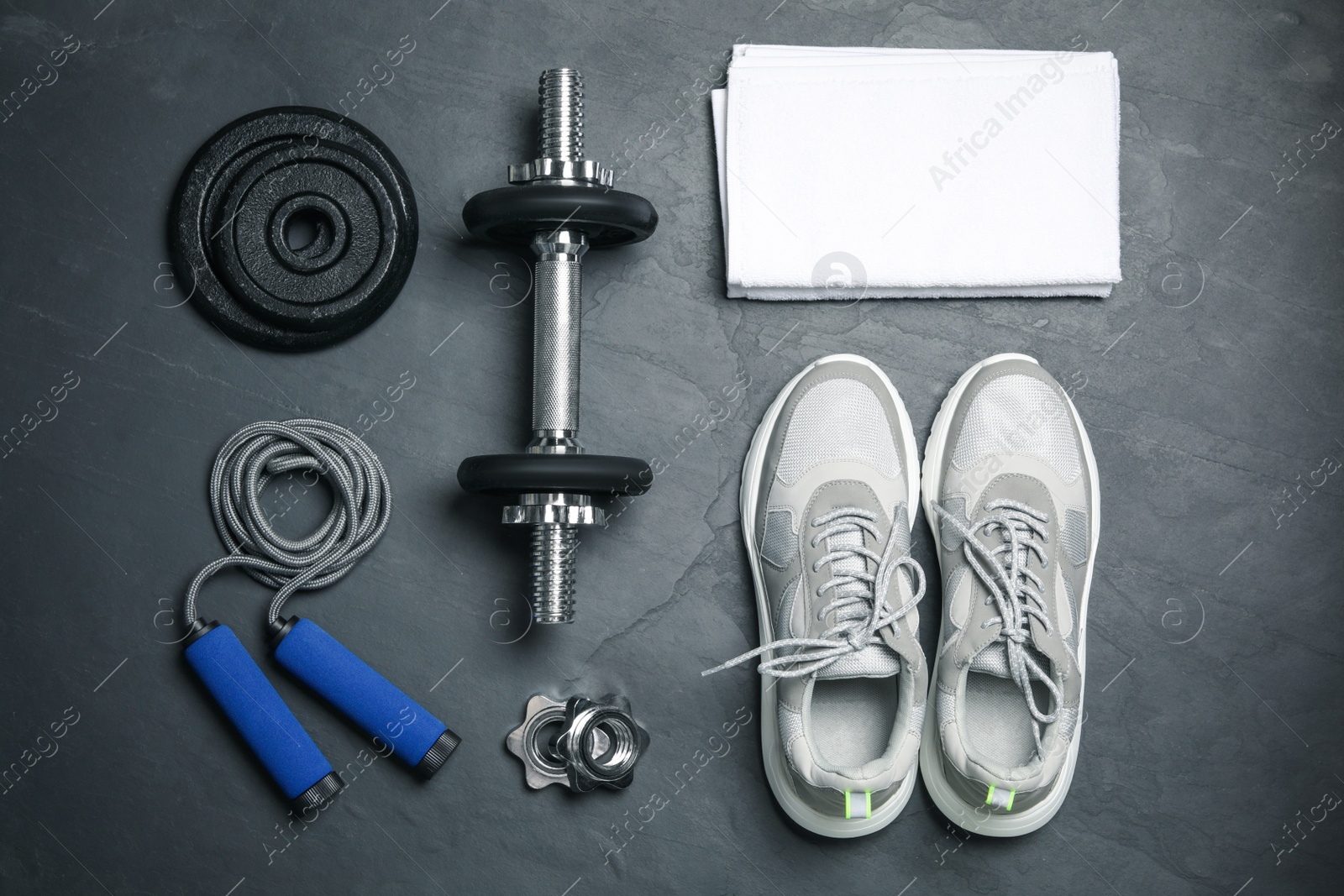 Gym equipment on black background, flat lay Photo of Gym equipment on black background, flat lay