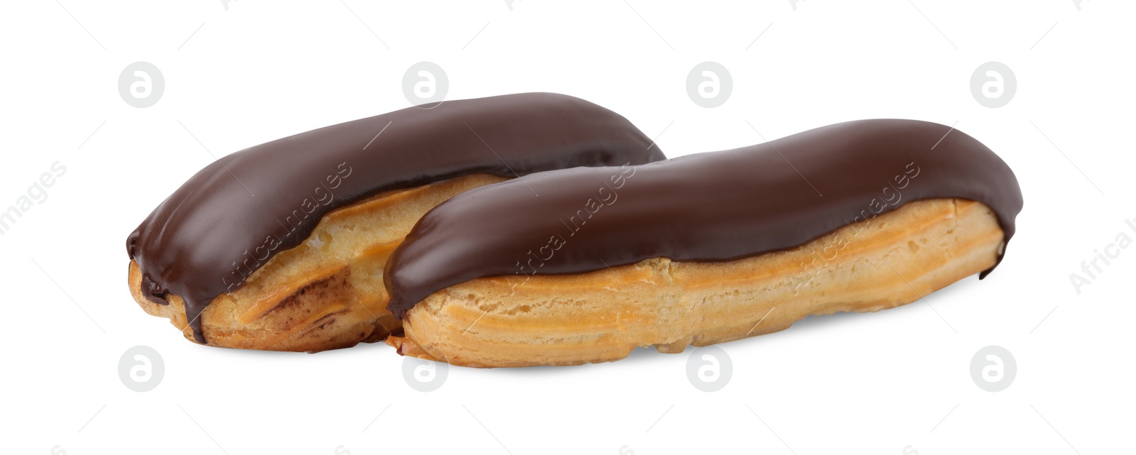 Photo of Delicious eclairs covered with chocolate isolated on white