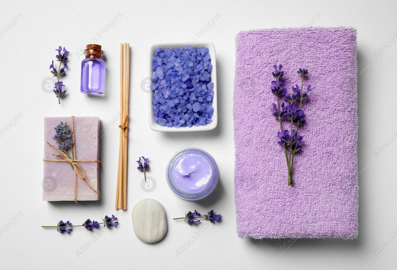 Photo of Cosmetic products and lavender flowers on white background, flat lay