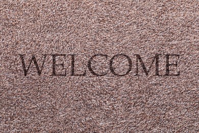 Image of Door mat with word WELCOME as background, top view