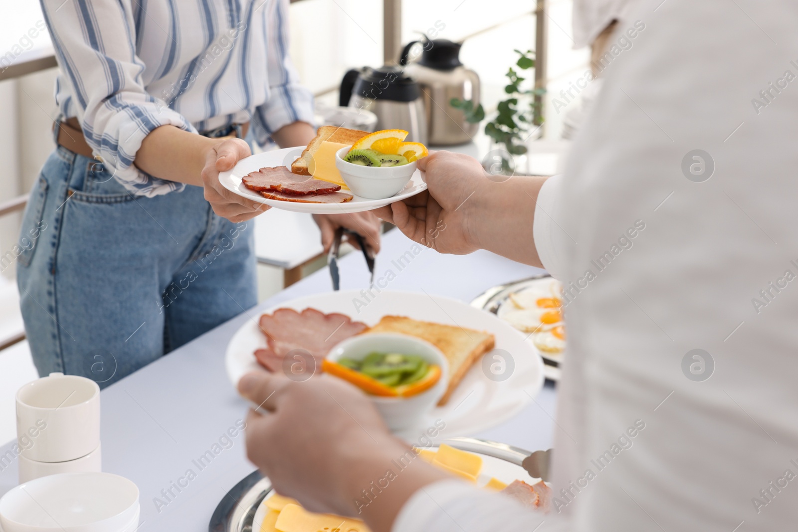 Photo of People taking food during breakfast, closeup. Buffet service