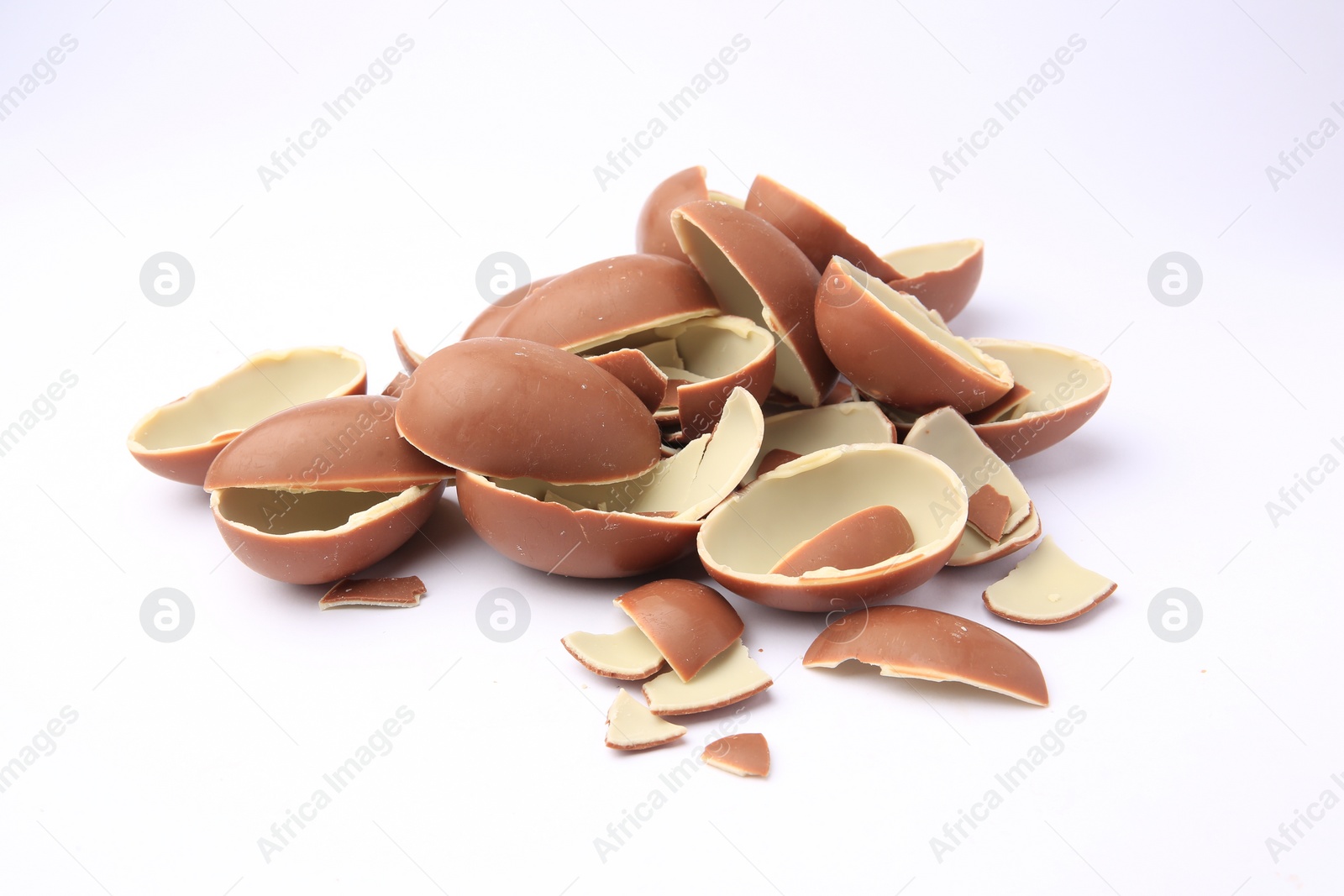 Photo of Sveti Vlas, Bulgaria - July 3, 2023: Broken halves of Kinder Surprise Eggs isolated on white