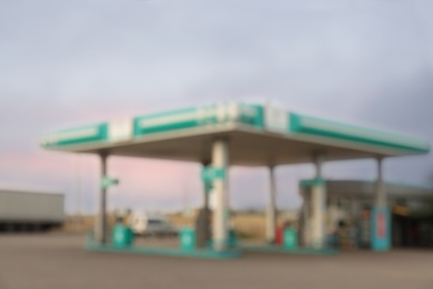 Photo of Blurred view of modern gas station outdoors