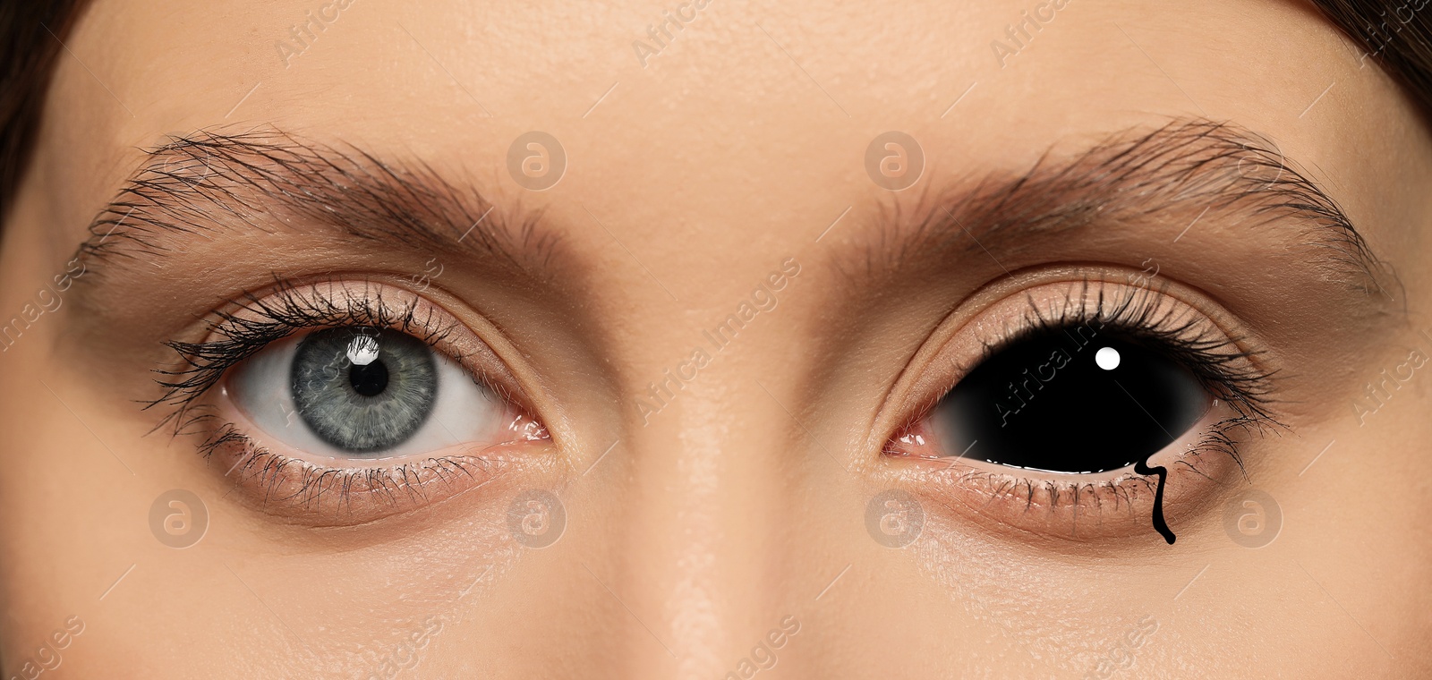 Image of Paranormality, supernatural or mental disorders concepts. Something black filling sclera and flowing from it. Woman with weird eye, closeup
