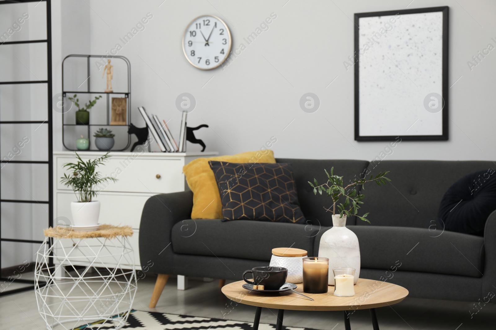 Photo of Living room interior with comfortable furniture and decorative elements