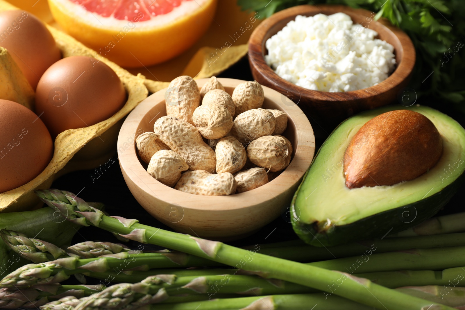 Photo of Nuts, cottage cheese, asparagus and other healthy food, closeup