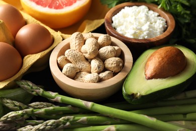 Photo of Nuts, cottage cheese, asparagus and other healthy food, closeup