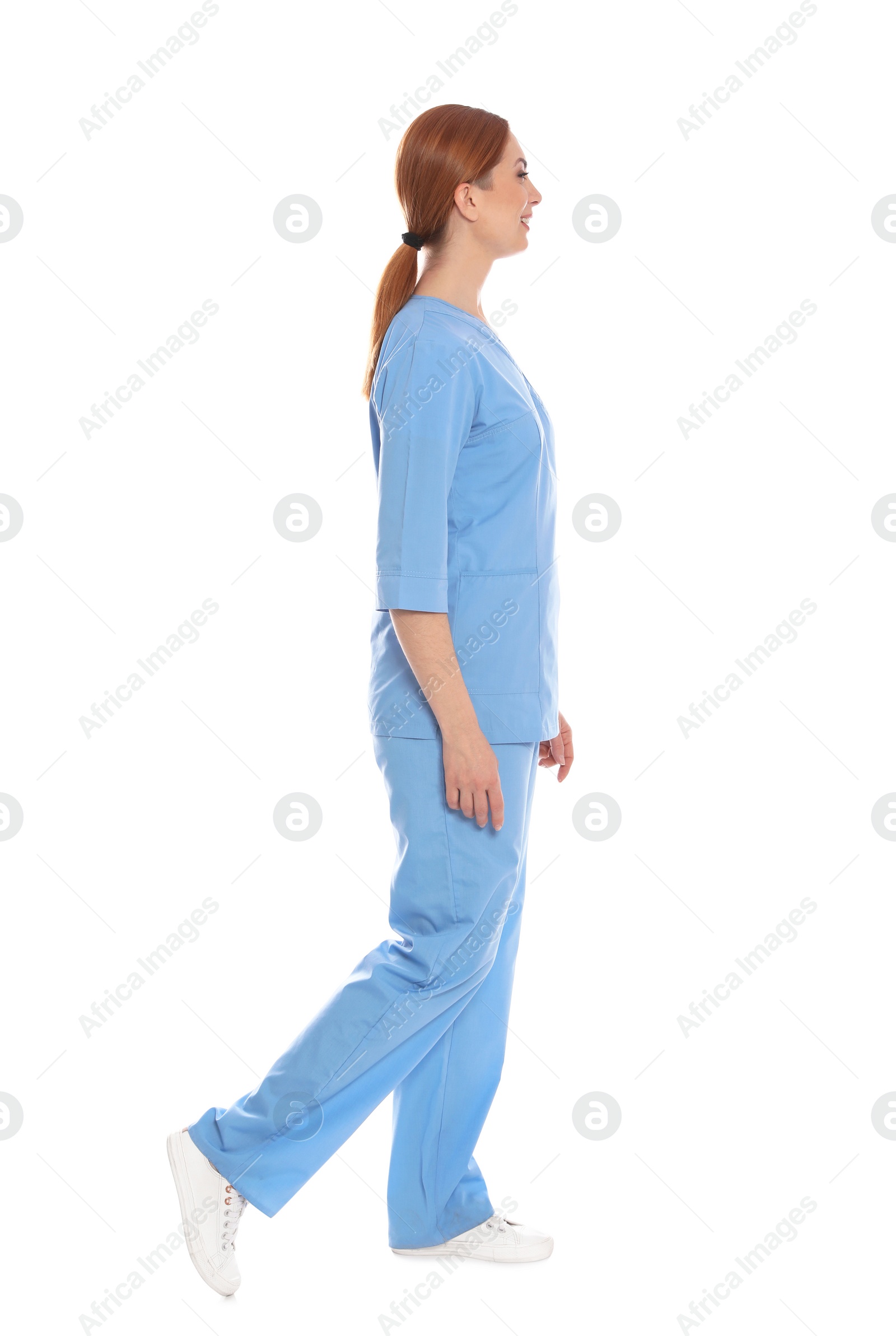 Photo of Full length portrait of medical doctor isolated on white
