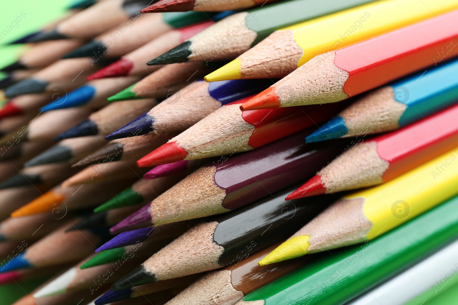 Photo of Different color pencils as background, closeup view