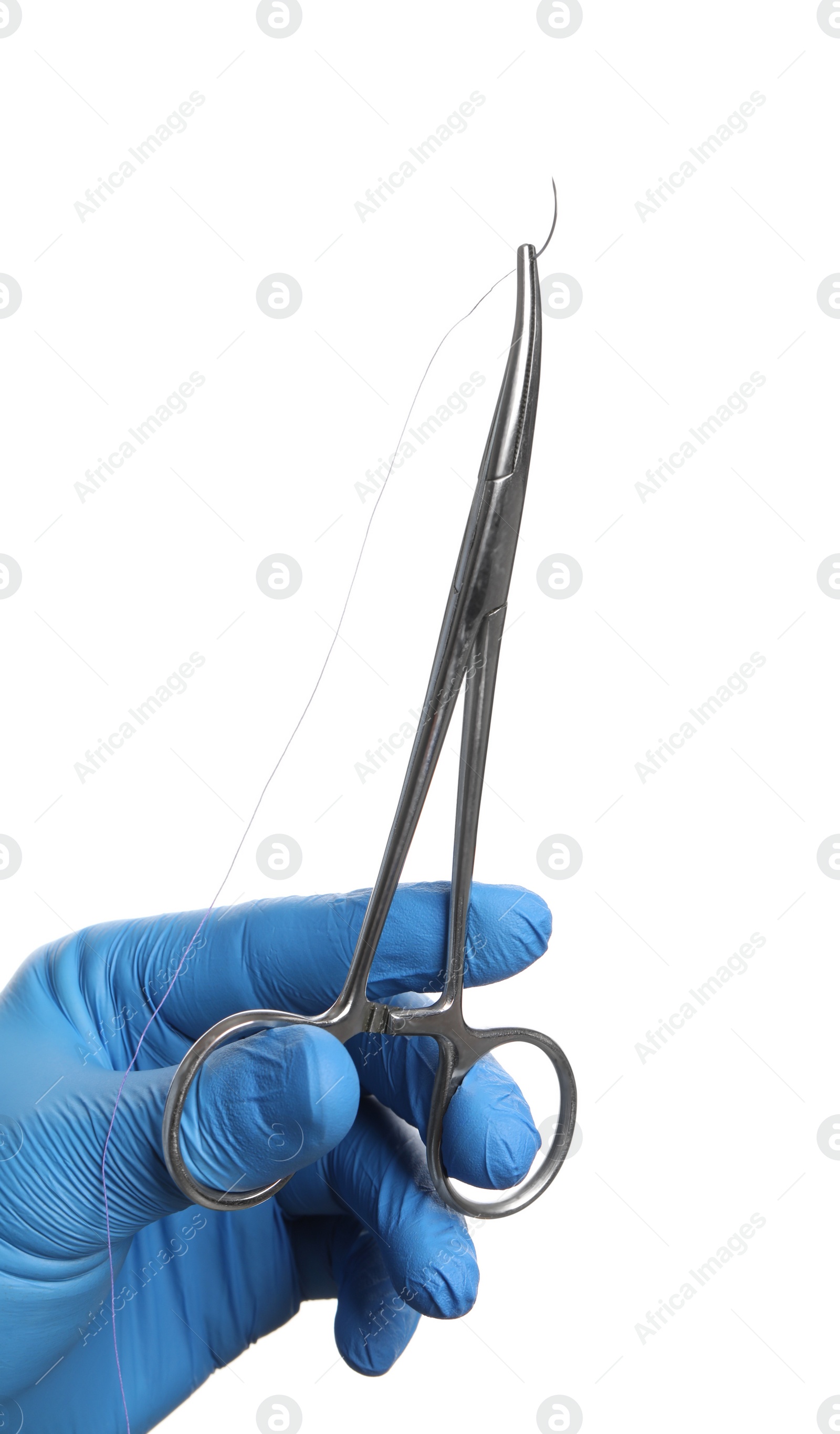 Photo of Doctor holding forceps with suture thread on white background, closeup. Medical equipment