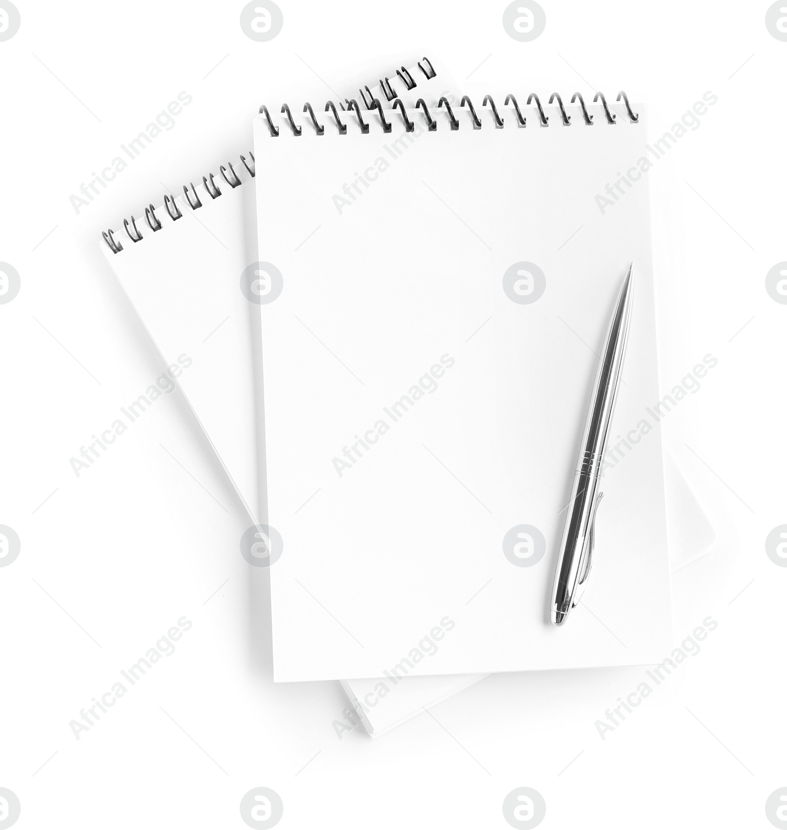 Photo of Two notebooks and pen isolated on white, top view