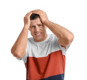 Young man suffering from headache on white background