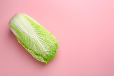 Fresh ripe Chinese cabbage on pink background, top view. Space for text