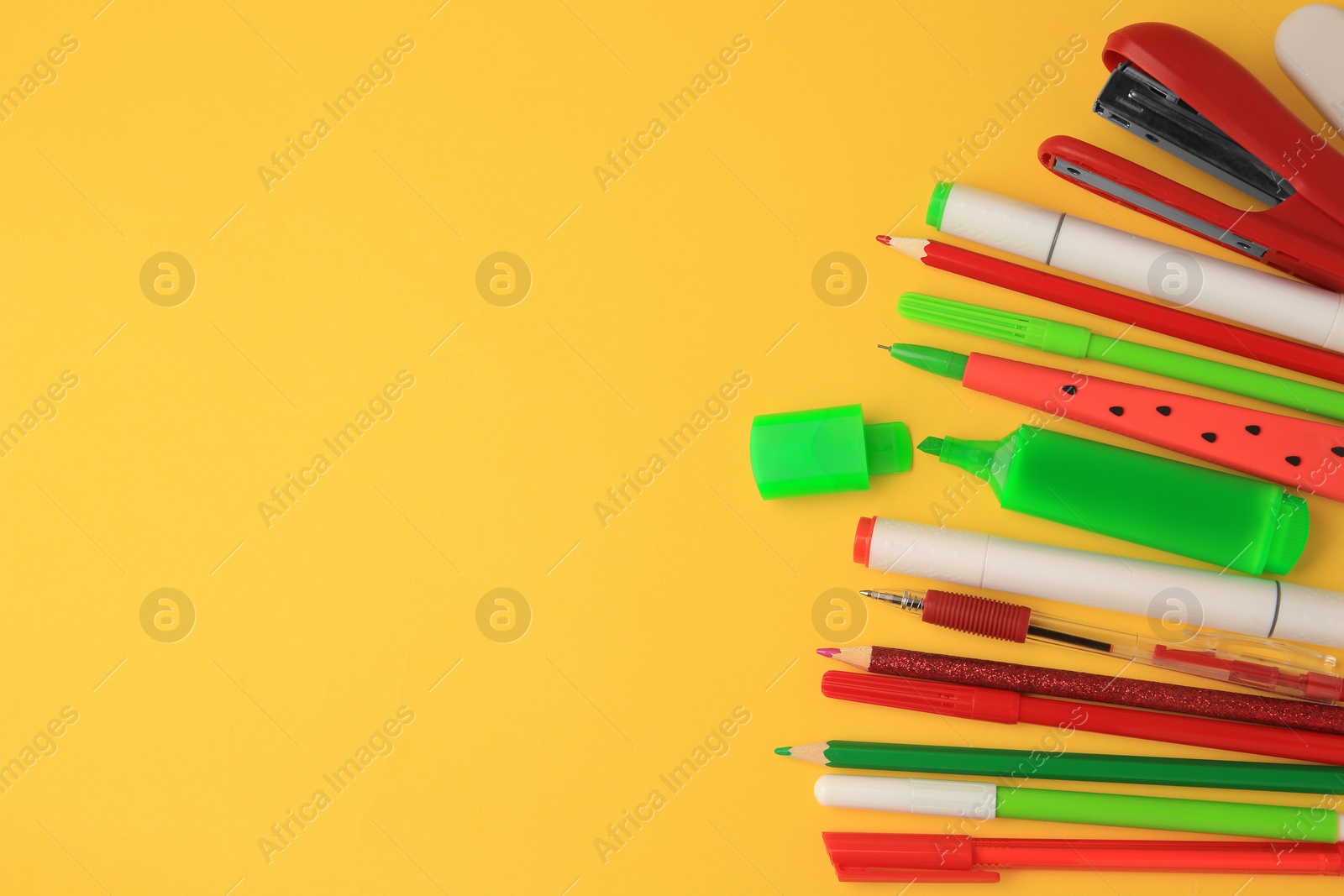 Photo of Flat lay composition with different school stationery on orange background, space for text. Back to school