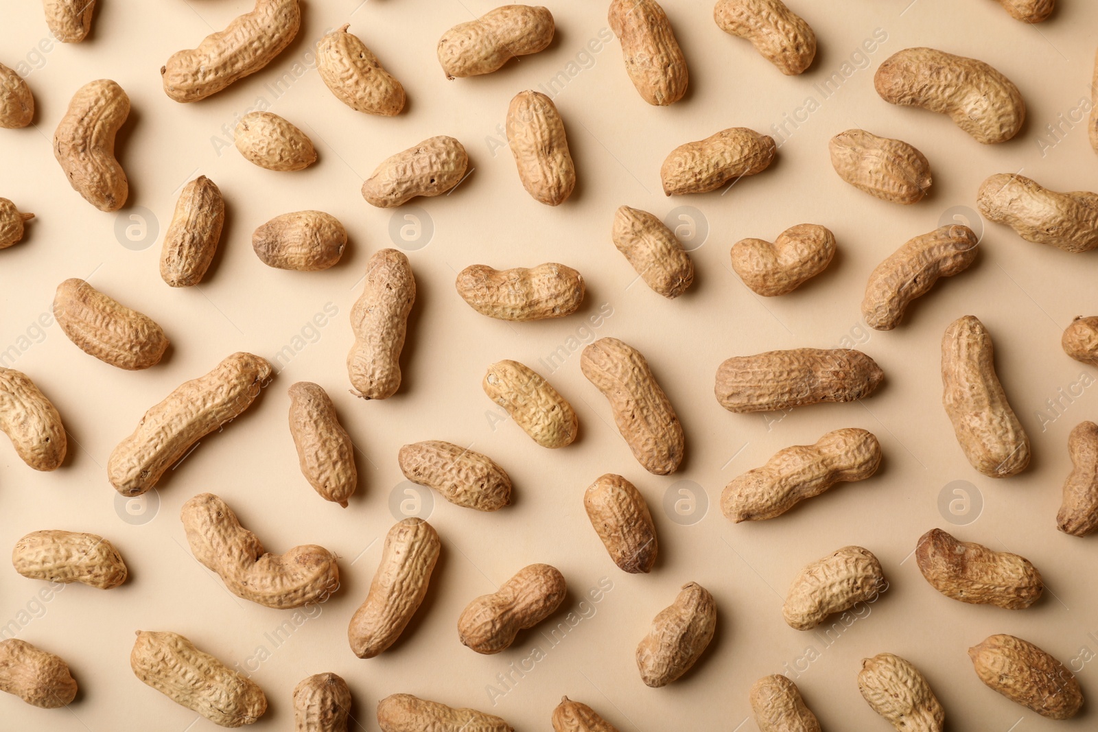 Photo of Composition with peanuts on color background, top view