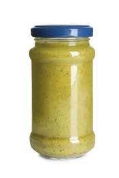 Delicious pesto sauce in glass jar on white background