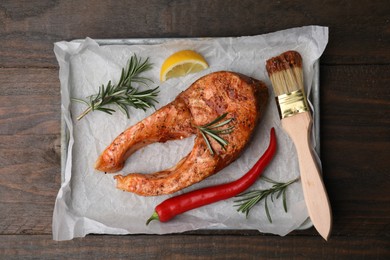 Fresh marinade, fish and other products on wooden table, top view