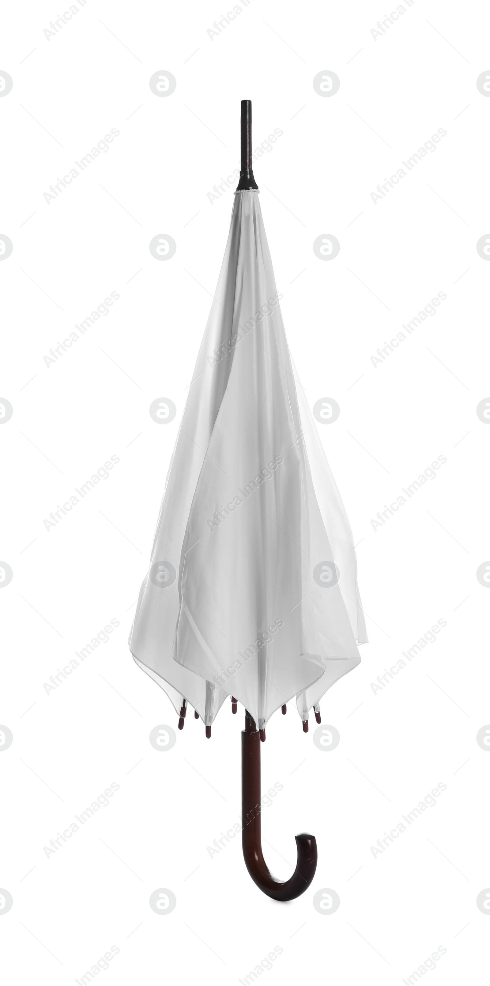 Photo of One closed straight umbrella isolated on white