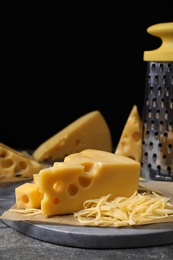 Tasty fresh cheese on grey table, closeup