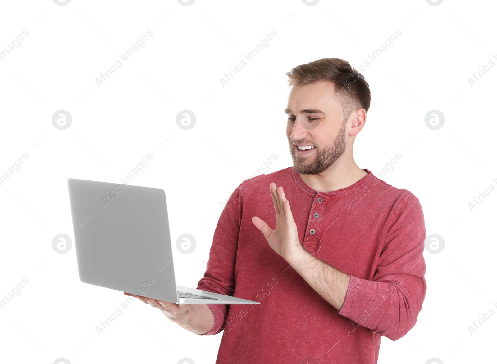 Photo of Young man using video chat on laptop against white background