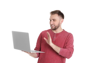 Photo of Young man using video chat on laptop against white background