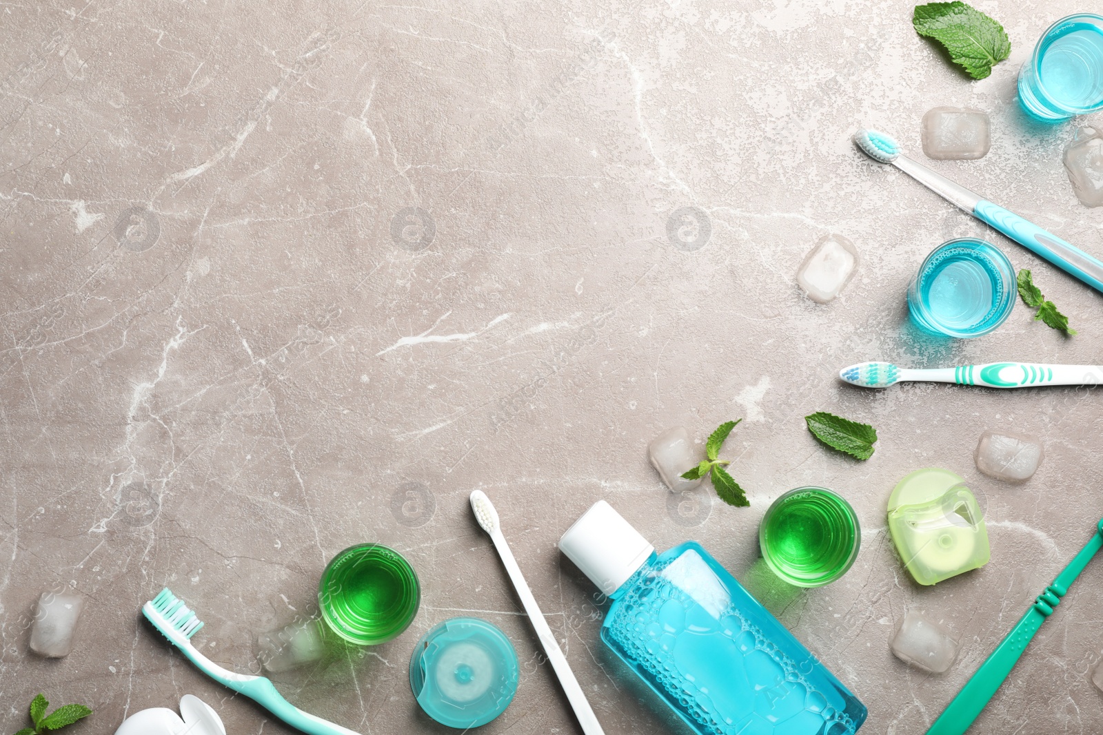 Photo of Flat lay composition with oral care products and space for text on marble background. Teeth hygiene