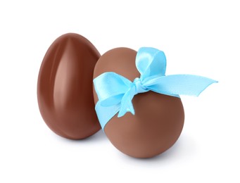 Photo of Two tasty chocolate eggs isolated on white