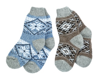 Photo of Different knitted socks on white background, top view