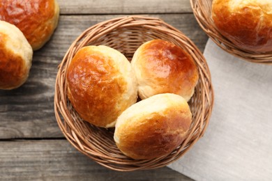 Photo of Freshly baked soda water scones on wooden table, flat lay