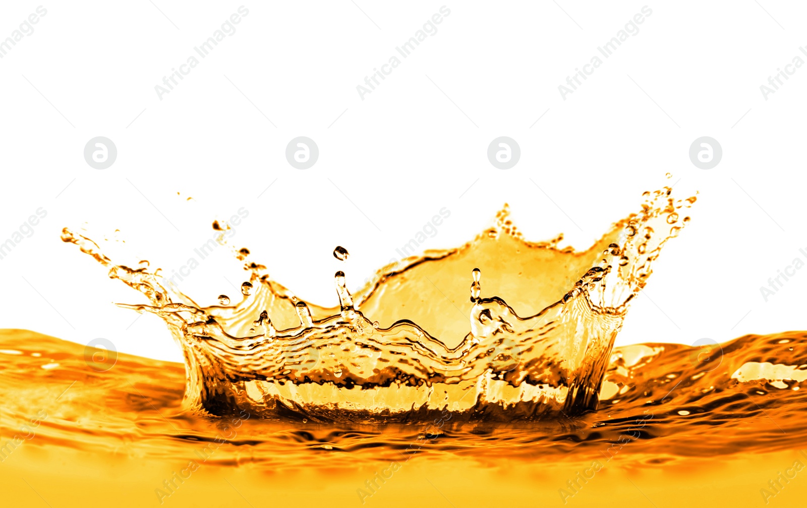 Image of Golden oily liquid splash on white background