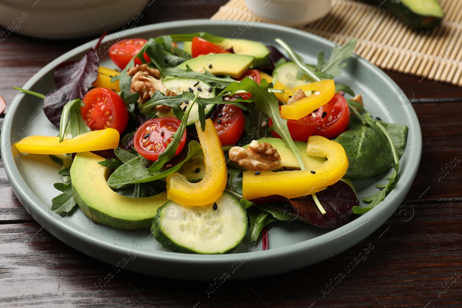 Photo of Balanced diet and vegetarian foods. Plate with different delicious products on wooden table, closeup