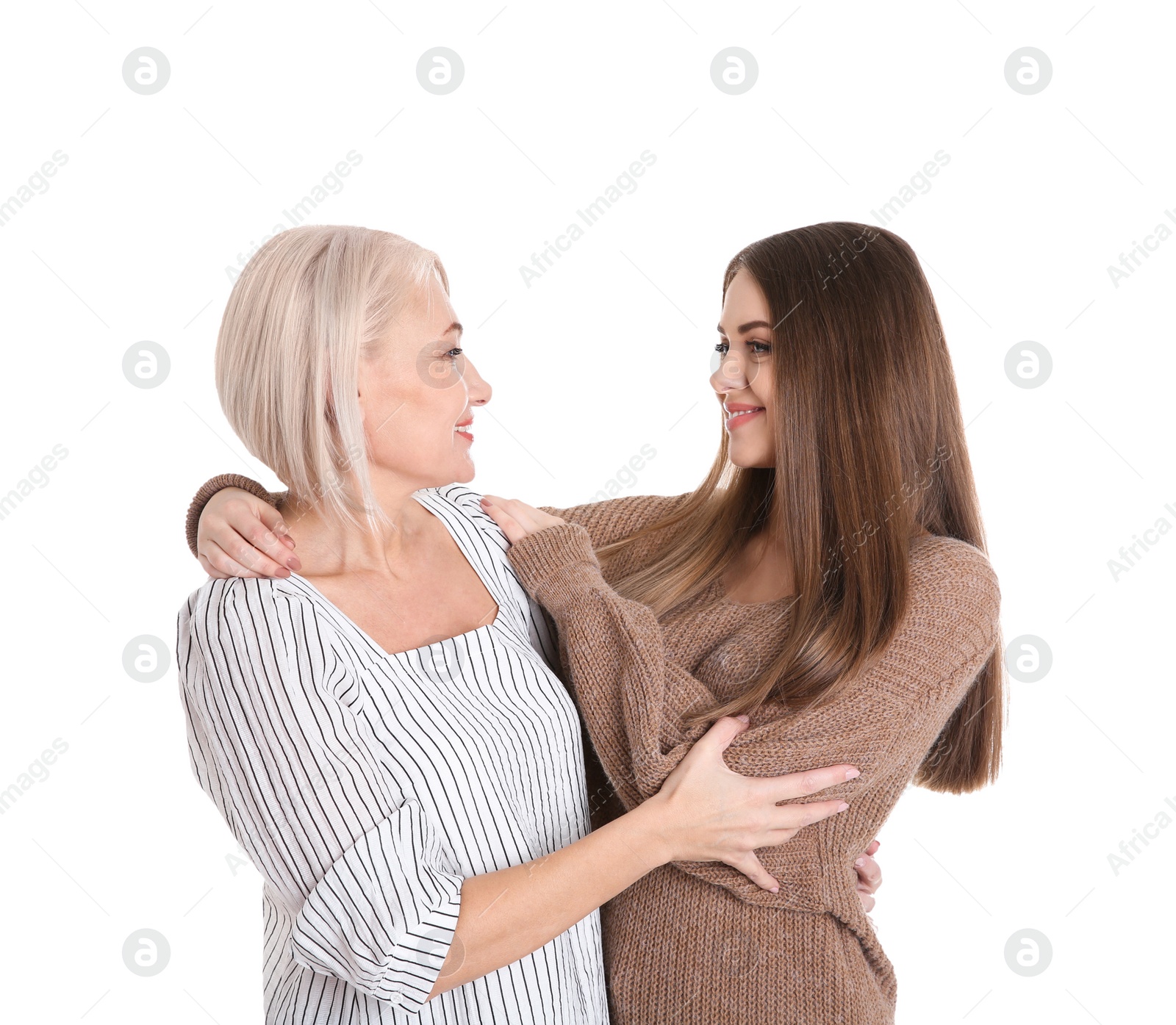 Photo of Portrait of young woman with her mature mother on white background