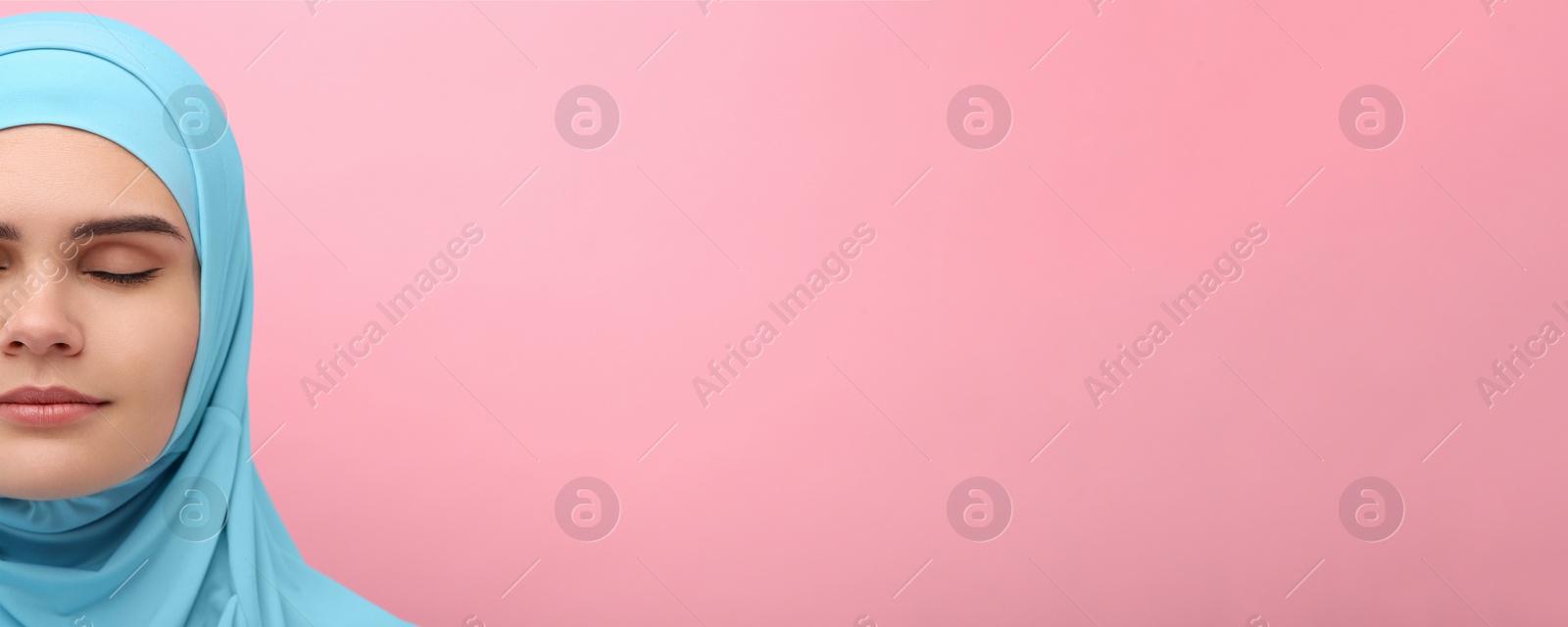 Image of Portrait of Muslim woman in hijab on pink background, space for text. Banner design