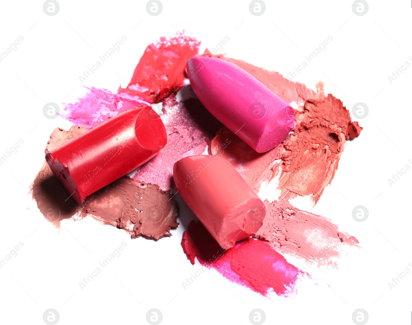 Photo of Different lipsticks and smears on white background