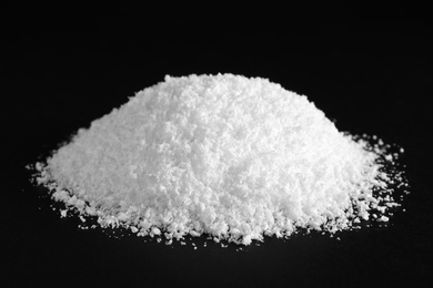 Photo of Heap of white snow on black background
