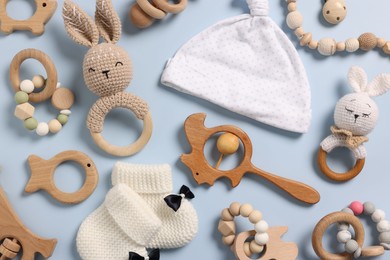 Photo of Different baby accessories on light blue background, flat lay