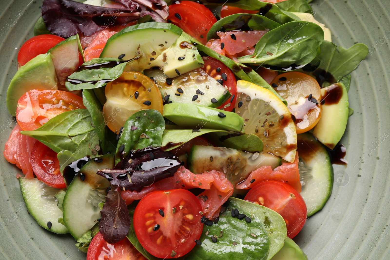 Photo of Delicious vegetable salad in bowl, top view