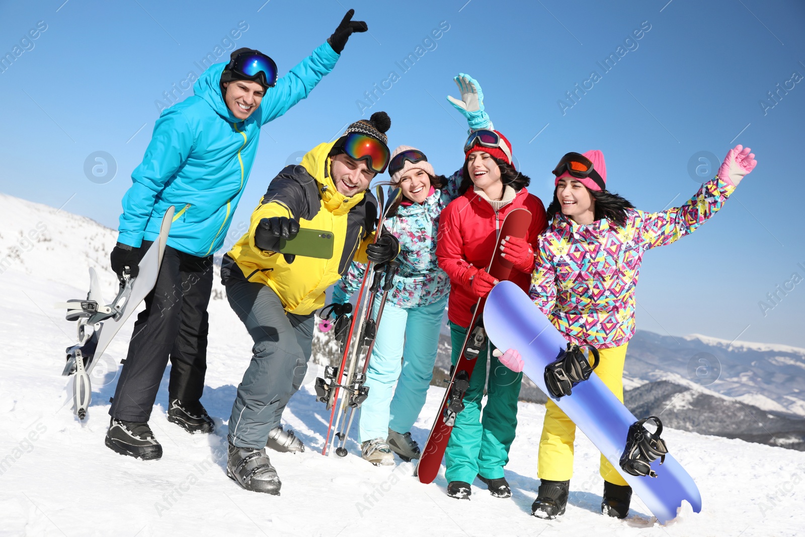 Photo of Group of friends taking selfie outdoors. Winter vacation