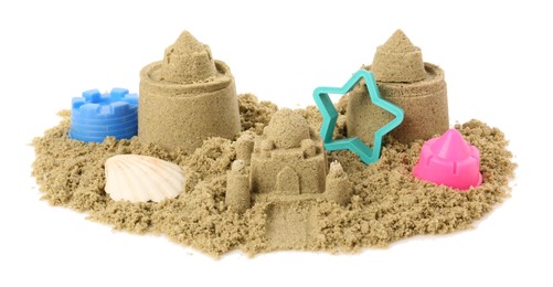 Photo of Pile of sand with beautiful castles, plastic toys and shell isolated on white