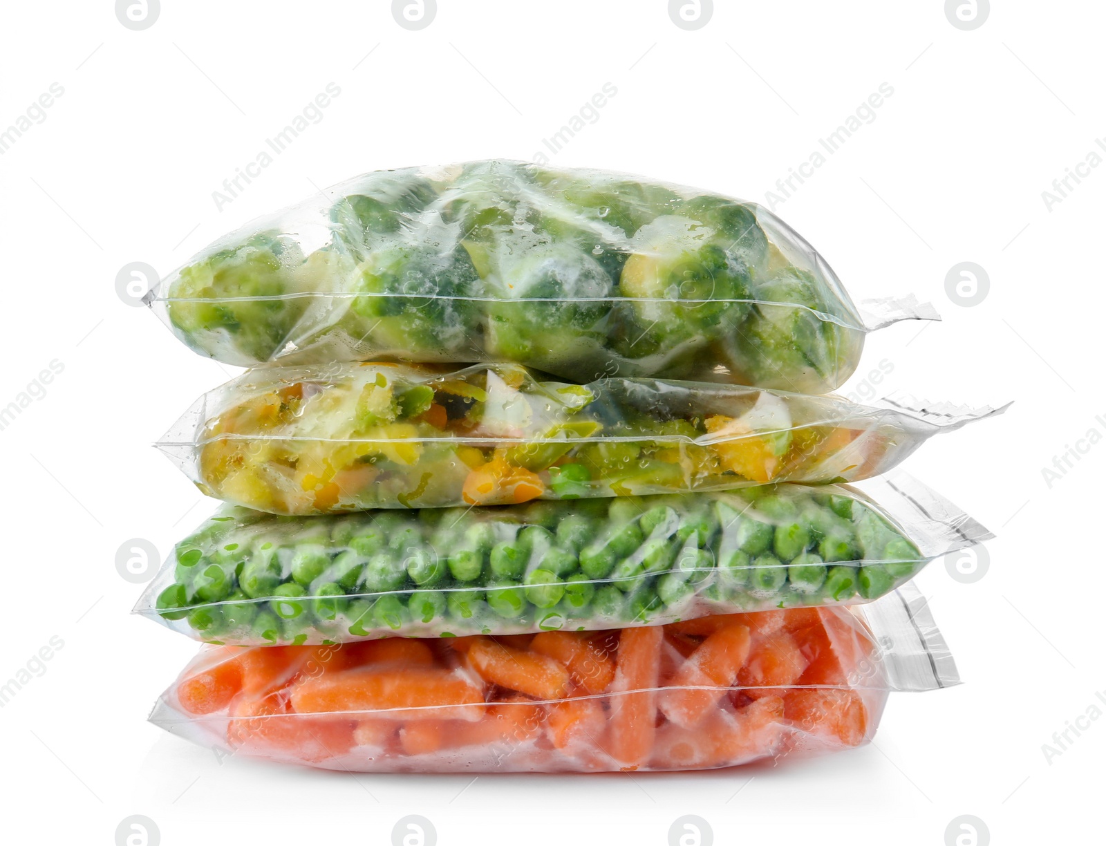 Photo of Plastic bags with frozen vegetables on white background