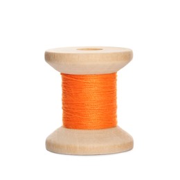 Photo of Wooden spool of orange sewing thread isolated on white