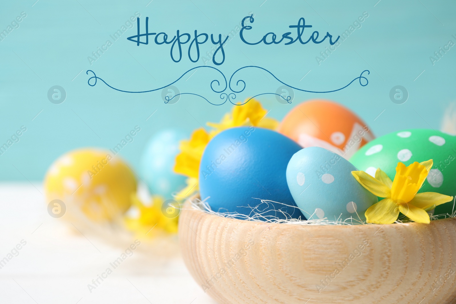 Image of Colorful eggs with flowers in wooden bowl and text Happy Easter on light blue background