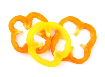 Photo of Rings of ripe bell peppers on white background, top view