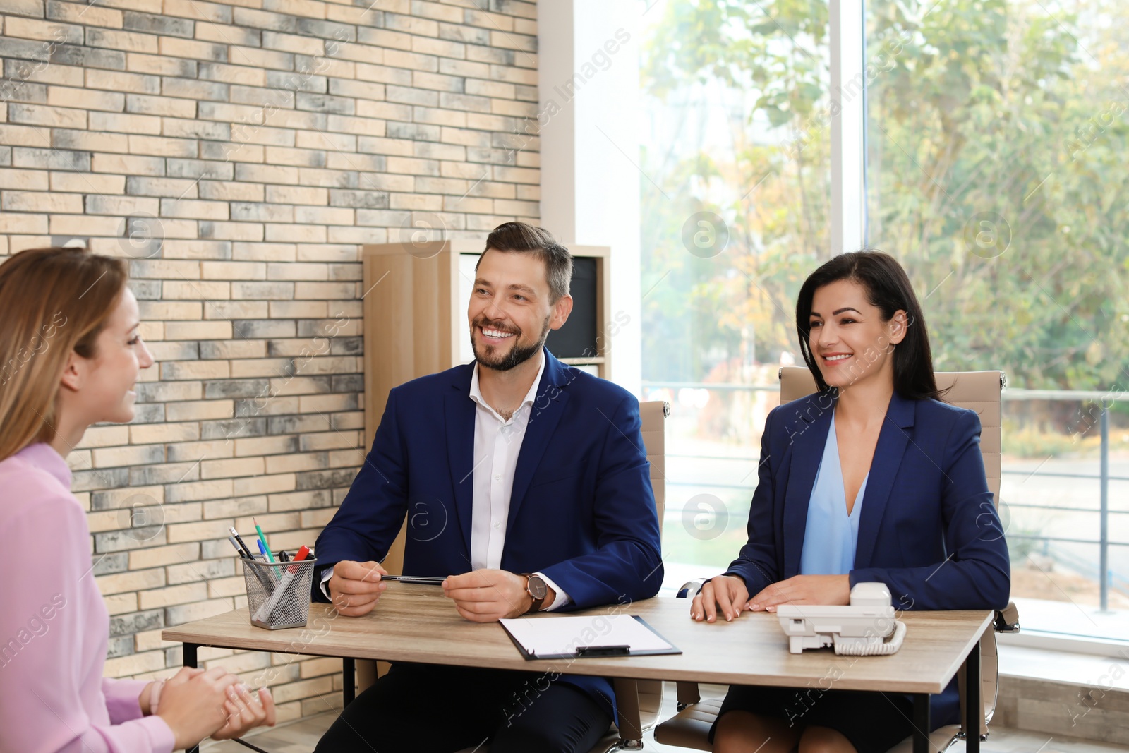 Photo of Human resources commission conducting job interview with applicant in office