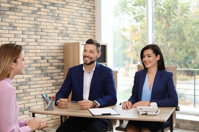 Human resources commission conducting job interview with applicant in office