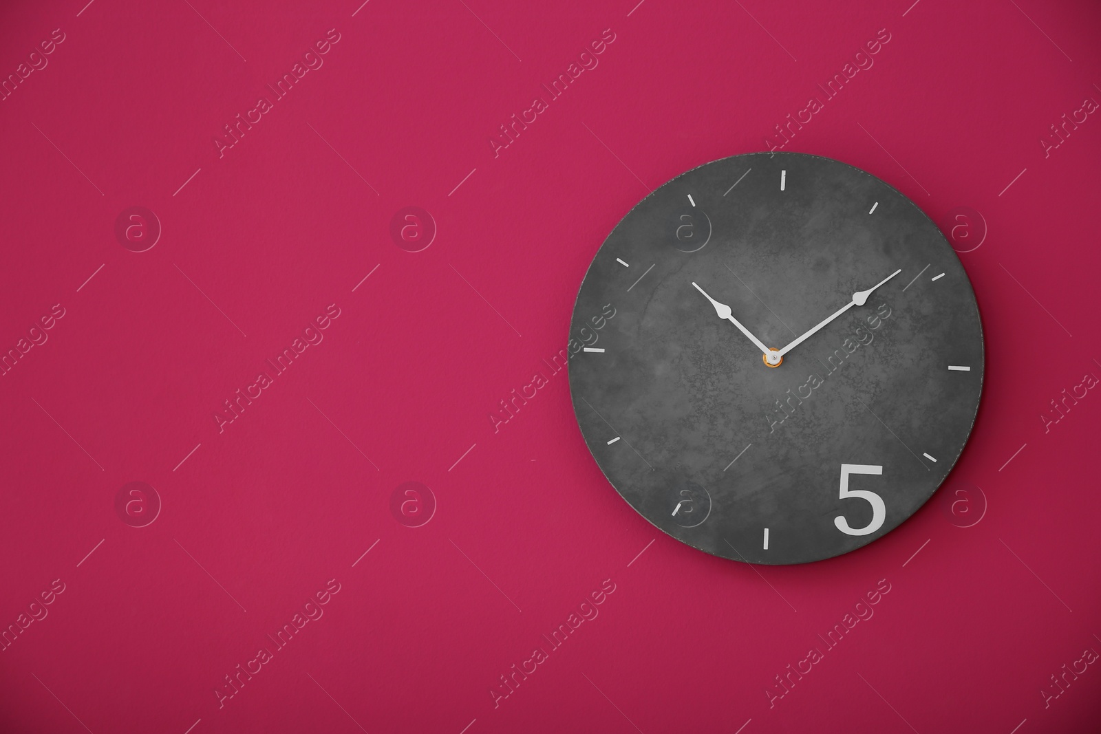 Photo of Stylish clock on color wall. Time concept